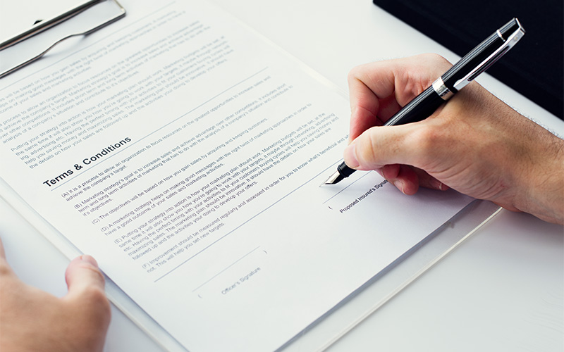 Investor signing an absolute assignment for traded endowment policies