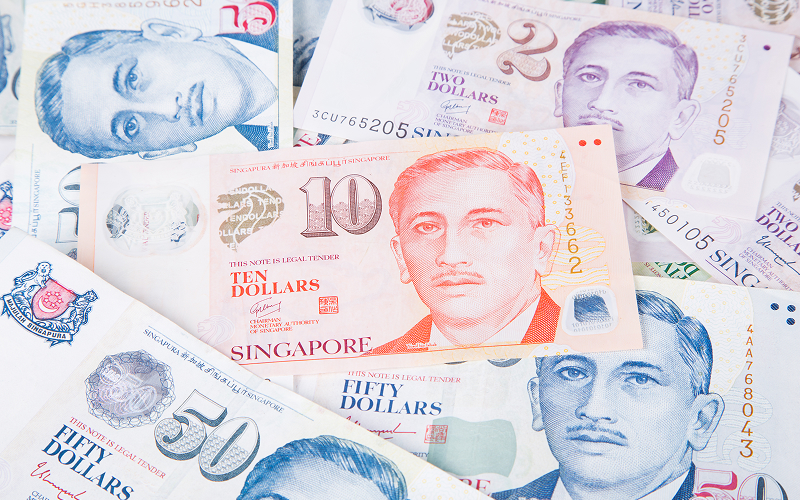 Assorted Singapore dollar banknotes including two, ten, and fifty dollars.